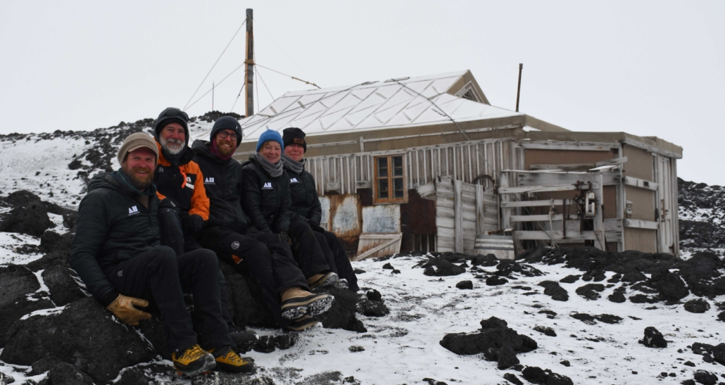 The Trust's 2023-24 On-Ice Conservation team at Shackleton's hut, Cape Royds. © AHT/Zack Bennett